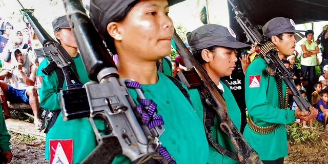 New People's Army rebels drill at an unspecified location in Surigao del Sur province, Mindanao, in December 2009. Philippine police and troops Sunday captured a woman who is one of the country's most wanted communist guerrillas, officials said.