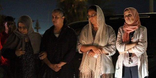 Benghazi residents gather in front of the Tibesti hotel following the assasination of a prominent Libyan political activist on July 27, 2013. Two powerful explosions went off near the courthouse in Benghazi Sunday night, leaving 10 people injured and causing damage, witnesses and a security source said.