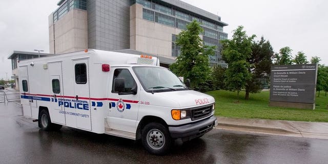 File picture shows a Toronto police van. Canadians demanded answers in the wake of a fatal police shooting of a knife-wielding teenager in Toronto that has sparked an uproar.