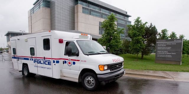File picture shows a Toronto police van. Canadians demanded answers in the wake of a fatal police shooting of a knife-wielding teenager in Toronto that has sparked an uproar.