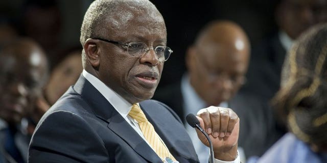 Uganda's Prime Minister Amama Mbabazi gives a speech at the World Economic Forum meeting on Africa, on May 9, 2013, in Cape Town. Mbabazi has accepted substantial damages from Britain's Daily Mail newspaper after it falsely claimed he and his "cronies" siphoned off millions of dollars of foreign aid, London's High Court heard.