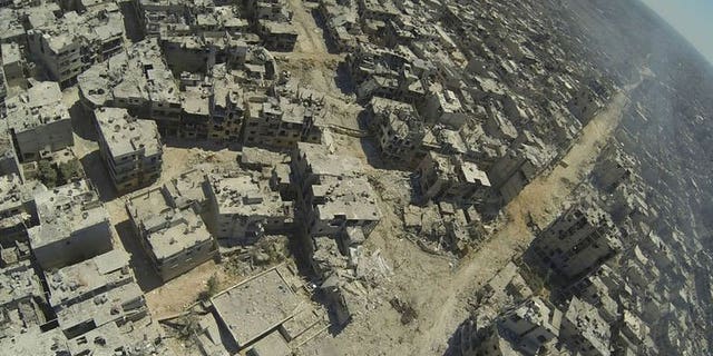 A handout image released by the Syrian opposition's Shaam News Network on July 29, 2013 shows an aerial view of destruction in the al-Khalidiyah neighbourhood of the central Syrian city of Homs. The regime's new victory in Homs and rebel advances in the north and south of Syria are signs that both sides are looking to make headway before much-touted peace talks.