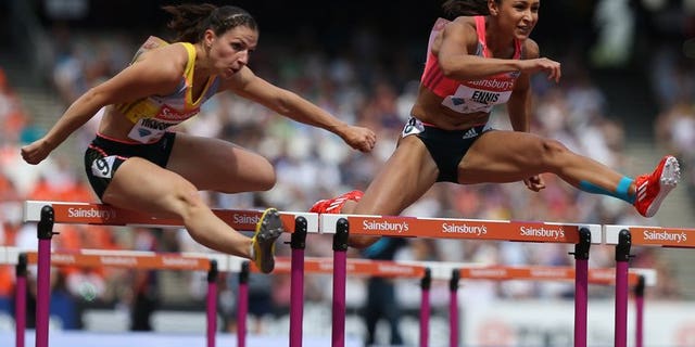 Jessica Ennis-Hill (right) and Nadine Hilderbrand in the 100m hurdles at the London Anniversary Games last Saturday. Olympic heptathlon champion Ennis-Hill has withdrawn from next month's athletics world championships because of injury, she and her coach said on Wednesday.