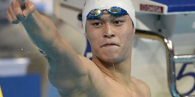 China's Sun Yang celebrates after winning the final of the men's 800-metre freestyle swimming event in the FINA World Championships at Palau Sant Jordi in Barcelona on July 31, 2013.