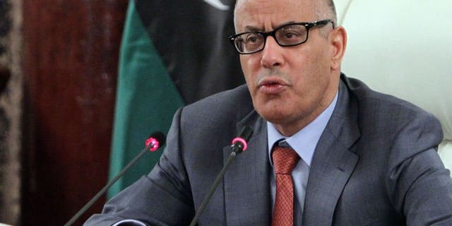 Libya's Prime Minister Ali Zeidan speaks during a press conference on July 31, 2013 in Tripoli. Zeidan said on Wednesday he had decided not to carry out an announced cabinet reshuffle aimed at resolving a political crisis and ending a wave of violence.