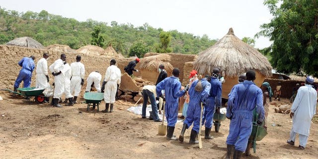 Health workers excavate soil contaminated with lead poison in Dareta village, in the Zamfara state on June 10, 2010. Medical charity MSF said Wednesday the Nigerian village that suffered an unprecedented and deadly lead poisoning outbreak had been cleared of the toxin, but that nearly 1,000 exposed children needed treatment.