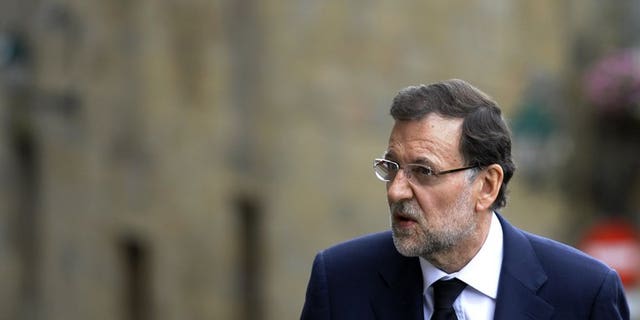 Lawmakers on Thursday will grill Spain's Prime Minister Mariano Rajoy, pictured July 29,2013, over a corruption scandal that has sparked calls for him to quit.