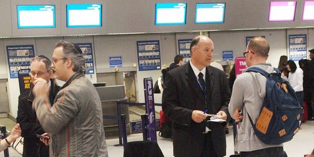 Passengers in the check-in area at Luton Airport north on London. Spanish infrastructure group Abertis said on Thursday it had agreed to sell London-Luton airport for 433 million pounds (502 million euros/$665 million) to a consortium led by Spain's airport operator.