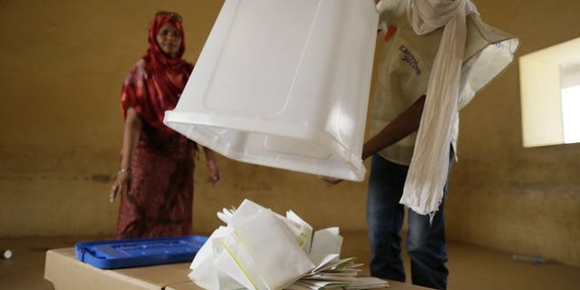 Malian electoral agents count the votes at a polling station in Kidal, northern Mali, on Monday. The results of the first round of Mali's presidential election will be announced on Friday, a day later than expected, the presidency said Thursday.