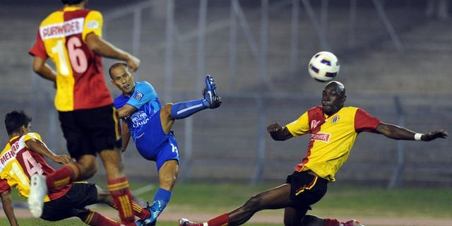India's East Bengal players compete for the ball with Thailand's Chonburi's Chaiman Therdsak (centre) during their AFC Cup match at Salt Lake stadium in Kolkata on March 2, 2011. India's football chiefs backed a proposal to hold a new tournament inspired by cricket's popular Indian Premier League, despite fierce opposition from the country's top clubs.