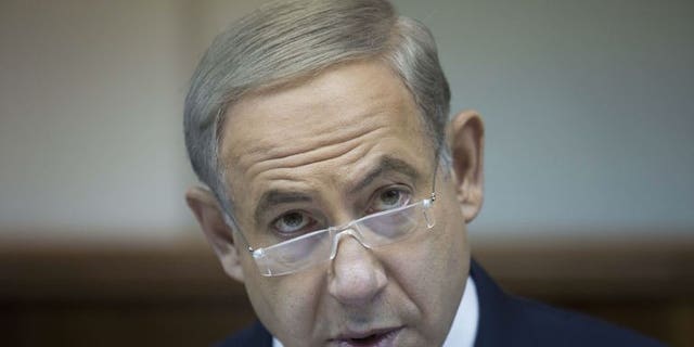 Israeli Prime Minister Benjamin Netanyahu attends the weekly cabinet meeting in his Jerusalem office, on July 14, 2013. Netanyahu has hailed new US sanctions over Iran's nuclear programme, approved ahead of the new Iranian president's inauguration.