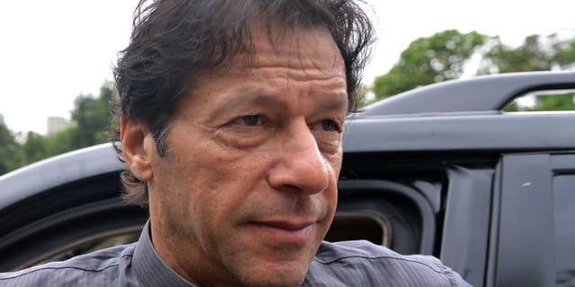 Pakistani politician Imran Khan arrives to appear before the Supreme Court in Islamabad, on August 2, 2013. The court has ordered the cricketer-turned-politician to respond in more detail over allegations that he committed contempt by making derogatory remarks against the judges.