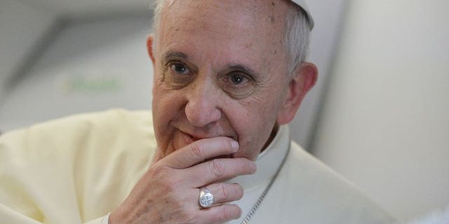 Pope Francis listens to a question during a press conference held aboard the papal flight on July 28, 2013. The pontiff has called for "mutual respect" between Christianity and Islam and an end to "unfair criticism" in a personal message congratulating Muslims on the feast of Eid al-Fitr.
