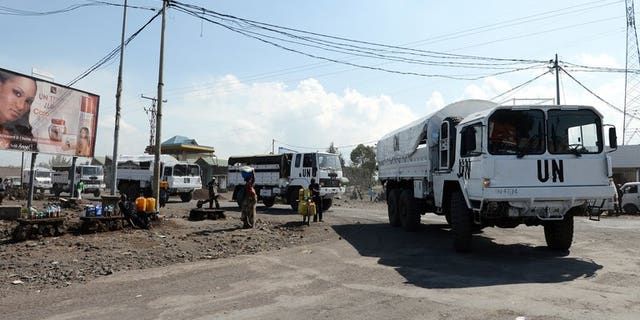 UN peacekeepers from Tanzania drive a convoy through the streets of Goma on May 29, 2013. Police have fired tear gas to disperse protesters who hurled stones at a UN peacekeepers' convoy in the volatile east of the Democratic Republic of Congo, one of several small demonstrations demanding an extension of the security zone.
