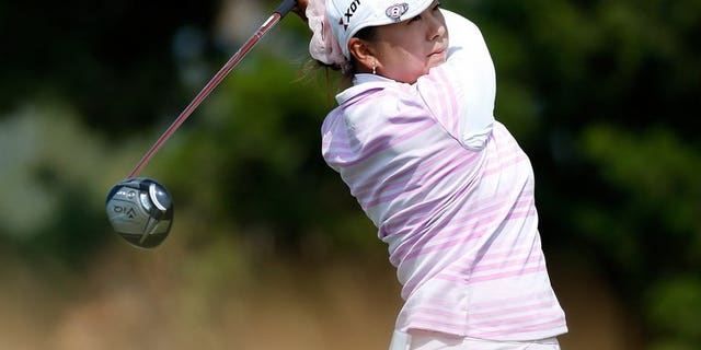 Miki Saiki of Japan watches her tee shot on the 15th hole at Sebonack Golf Club on June 28, 2013 in Southampton, New York. Saiki had a bundle of new experiences as she surged into the halfway lead on nine under par at the women's British Open at St Andrews on Friday.