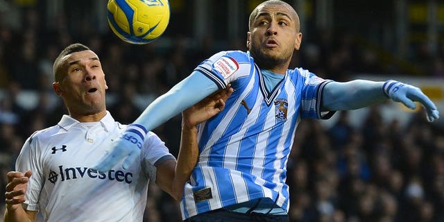 Coventry City's Leon Clarke (right) outjumps Tottenham's Steven Caulker in an FA Cup game at White Hart Lane on January 5. Coventry City said on Friday they were on the verge of liquidation, which will trigger a 15-point deduction just 24 hours before their 2013-2014 League One season begins.