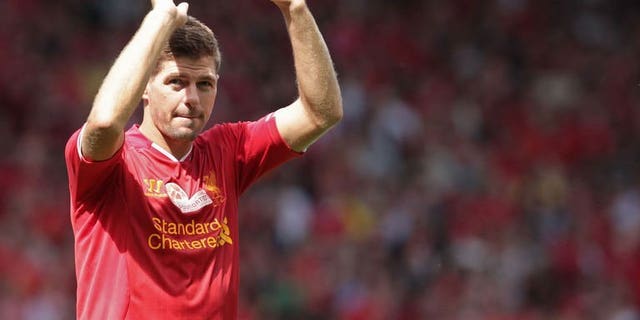 Liverpool captain Steven Gerrard waves to fans after their 2-0 win in the pre-season friendly match against Olympiakos in Liverpool on August 3, 2013. Liverpool supporters paid tribute to Gerrard as their Reds continued preparations for the start of the Premier League season with a 2-0 victory over Olympiakos.