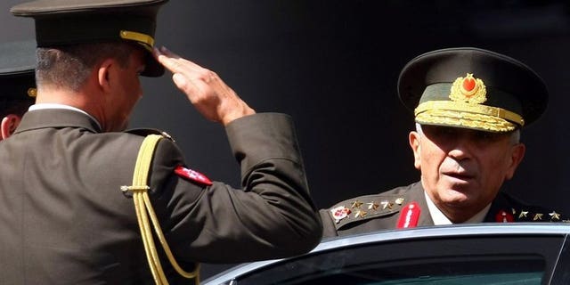 Turkey???s Commander Bekir Kalyoncu (R) arrives for a security meeting in Ankara on August 4, 2011. Prime Minister Recep Tayyip Erdogan decided on the forced retirement of General Bekir Kalyoncu, who had been expected to become land forces commander.