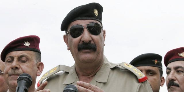Iraqi Staff Lieutenant General Abdulamir al-Zaidi addresses troops in Kirkuk on October 21, 2012. Zaidi said he survived a bombing on Saturday that killed nine soldiers during an operation against Al-Qaeda militants in Diyala province north of Baghdad.