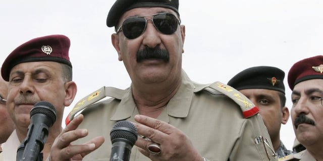 Iraqi Staff Lieutenant General Abdulamir al-Zaidi addresses troops in Kirkuk on October 21, 2012. Zaidi said he survived a bombing on Saturday that killed nine soldiers during an operation against Al-Qaeda militants in Diyala province north of Baghdad.