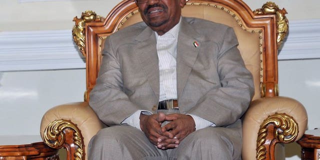 Sudanese President Omar al-Bashir attends a meeting in Khartoum on July 25, 2013. Saudi Arabia denied permission for a plane carrying Sudanese President Omar al-Bashir to travel through its airpace on Sunday for the swearing-in of the new Iranian president, Khartoum said.