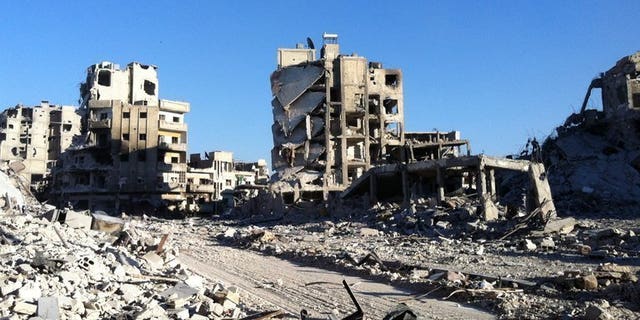 Destroyed buldings are seen in the Khaldiyeh district of Homs, on July 28, 2013. Syrian President Bashar al-Assad, increasingly confident after his forces inflicted two major defeats on rebels in as many months, repeated on Thursday that he was "sure of victory."