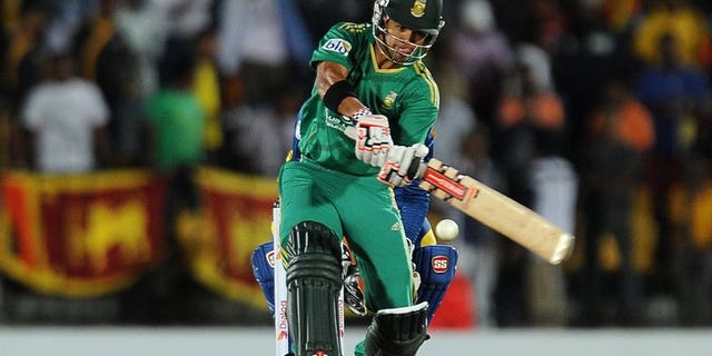 South African batsman JP Duminy plays a shot during the Twenty20 match against Sri Lanka in the district of Hambantota on August 4,2013. South Africa's captain Faf du Plessis won the toss and chose to bat in windy conditions in the second Twenty20 international against Sri Lanka in Hambantota