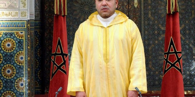 Handout photo released by Moroccan Press Agency shows King Mohammed VI on July 30, 2013 in Casablanca. King Mohamed VI of Morocco on Sunday revoked a pardon granted to a Spanish serial paedophile whose release sparked angry protests in the kingdom, a palace statement said.