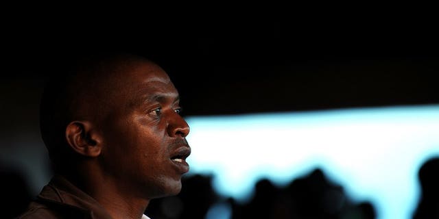 Burundi rebel leader Agathon Rwasa sings his party's anthem during a political rally in the south western town of Nyanza-Lac on May 12, 2010. Rwasa, the historical leader of Burundi's main opposition group, will make his first public appearance in three years and announce his plan to run for president in 2015, his spokesman said.