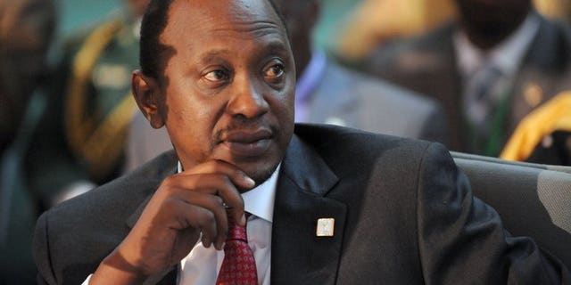 Kenyan President Uhuru Kenyatta at an African Union Summit in Abuja on July 16, 2013. Kenya on Monday revoked all mining licences granted in the months before and after March elections and announced that it was hiking royalties paid by companies operating in its nascent mining sector.