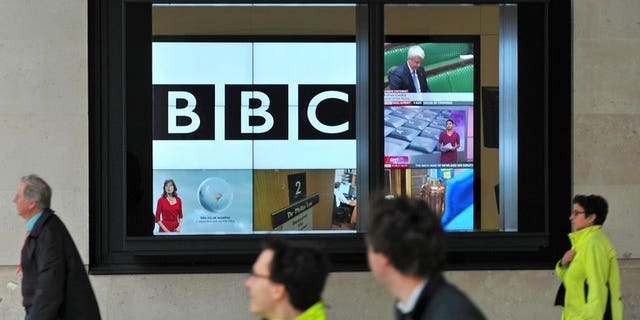 A BBC logo is pictured on a television screen inside the BBC's New Broadcasting House office in central London, on November 12, 2012. Female former newsreader Charlotte Green was on Tuesday appointed by the British Broadcasting Corporation (BBC) as the reader of the classified football results on BBC Radio 5 Live.