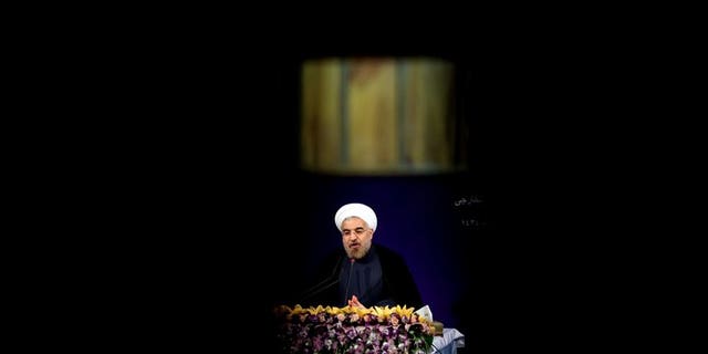 Iran's President Hassan Rowhani adresses his first news conference after taking office, in Tehran on August 6, 2013. Iran's parliament began debating on Monday the 18-member cabinet proposed by President Hassan Rowhani ahead of a vote of confidence later in the week.