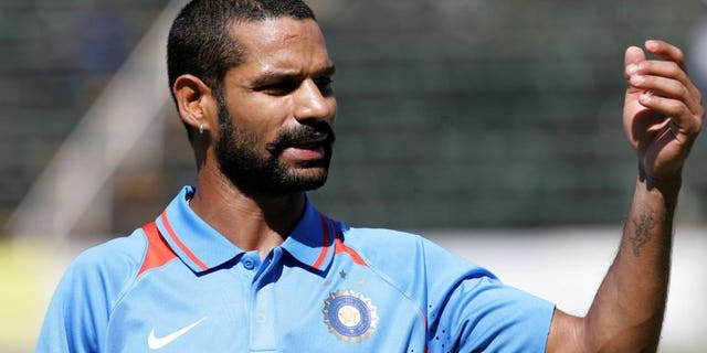 Indian batsman Shikhar Dhawan gestures for drinks during a one-day inernational against Zimbabwe at the Harare Sports Club, on July 26, 2013. Dhawan has struck 248 runs as India A made 433-3 to win a 50-over match against South Africa A.