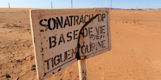 A road sign near a compound belonging to Algeria's Sonatrach oil company in the deep south desert on January 19, 2013. International arrest warrants have been issued for former energy minister Chekib Khelil and eight others in connection with a corruption case at energy firm Sonatrach, Algeria's prosecutor general said Monday.