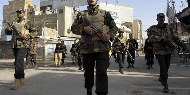 Pakistani police commandos patrol during a Shiite Muslim Ashura procession in Quetta on December 6, 2011. A bomb planted on a bicycle killed at least two people and wounded another in the restive province of Baluchistan in southwest Pakistan on Monday, officials said.