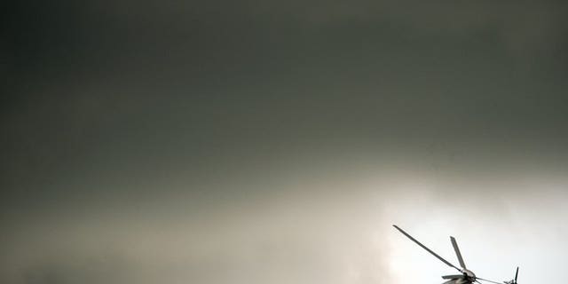 An AgustaWestland helicopter flies through the clouds at the Farnborough International Airshow in Hampshire, southern England, on July 11, 2012. Indian auditors accused the government Tuesday of breaking its own procurement rules to award a $748-million helicopter contract to Italian-owned AgustaWestland, which is under investigation for bribery, the Press Trust of India reported.