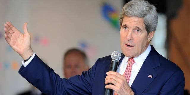 US Secretary of State John Kerry delivers a speech for US embassy employes and relatives in an event in Brasilia on August 13, 2013. Palestinian president Mahmud Abbas is committed to pursuing peace talks with Israel despite the unresolved issue of Israeli settlement building, Kerry said.