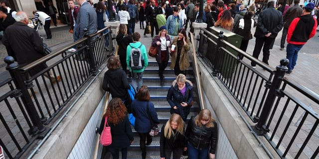 People enter an underground station in central London on October 17, 2012. Britain's unemployment rate remains at 7.8 percent, significantly above a level that could trigger the Bank of England to raise its main interest rate, official data showed on Wednesday.