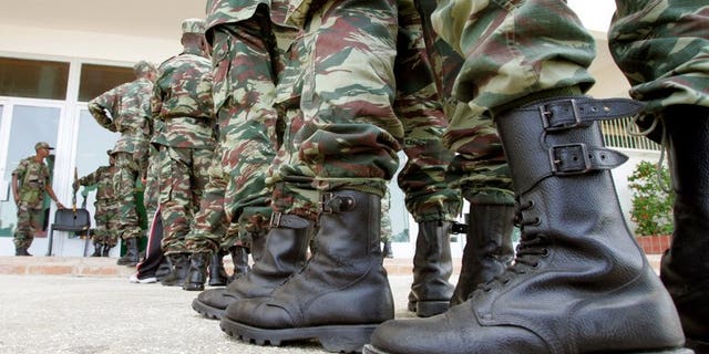 Mauritanian soldiers stand in line to vote at a polling center in Nouakchott on March 25, 2007. Mauritania said it would send soldiers to the United Nations peacekeeping force charged with ensuring security after elections in conflict-scarred Mali -- but only to areas near their shared border.
