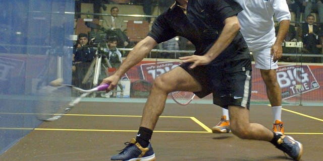 Pakistani squash legends Jahangir Khan (right) and Jansher Khan play during a friendly match at the Mushaf Squash Complex in Islamabad, 14 December 2005. Khan says the country must do more to improve its image and stop the rest of the world thinking of Pakistanis as "terrorists".