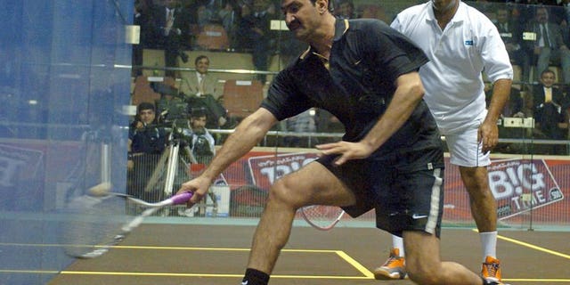 Pakistani squash legends Jahangir Khan (right) and Jansher Khan play during a friendly match at the Mushaf Squash Complex in Islamabad, 14 December 2005. Khan says the country must do more to improve its image and stop the rest of the world thinking of Pakistanis as "terrorists".