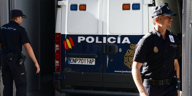 A Spanish police van carrying convicted child rapist Spaniard Daniel Galvan arrives at a courthouse in Madrid on August 6, 2013. Galvin jailed in Spain after he was controversially freed by the King of Morocco will appear before a judge in late August on historic abuse charges.