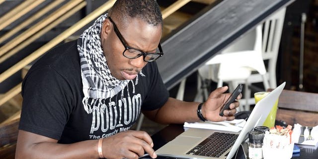 A man uses a tablet on November 14, 2012 in Johannesburg. African telecoms giant MTN posted an 11 percent rise in profits in the first half of 2013 boosted by an increase in subscribers to 201.5 million, the company said Wednesday.