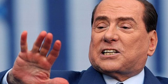 Former Italian premier Silvio Berlusconi delivers a speech during a campaign rally in Bari, on April, 13, 2013. Berlusconi's lawyer said he believed the former premier would request -- and could be granted -- a presidential pardon following his tax fraud conviction, sparking a heated debate in Italy.