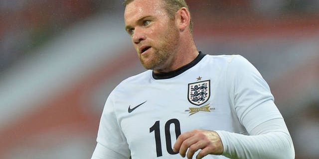 England striker Wayne Rooney plays during the international friendly football match between England and Scotland at Wembley Stadium in London on August 14, 2013. Rooney finally got the chance to prove his fitness as the unsettled Manchester United striker played for 66 minutes of England's 3-2 win against Scotland at Wembley on Wednesday.