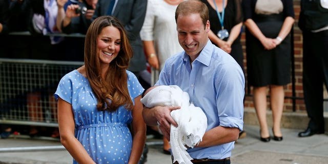 Prince William and Catherine with Prince George outside St Mary's Hospital in London on July 23. Kate will next month attend her first public engagement since giving birth, when she takes part in a charity event with her husband, the palace said on Thursday.