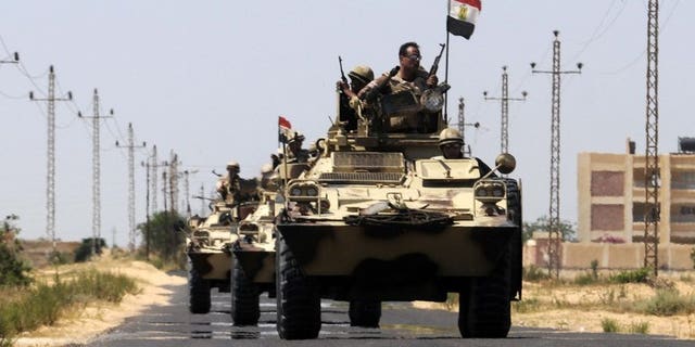 Egypt soldiers are deployed in the area of the Rafah Crossing border between Egypt and the Gaza Strip, on May 21, 2013. Militants in Egypt's Sinai peninsula on Thursday killed seven soldiers in an attack on a checkpoint, security officials said.