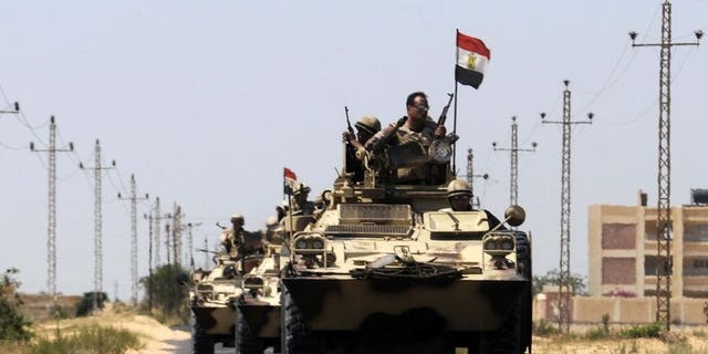 Egypt soldiers are deployed in the area of the Rafah Crossing border between Egypt and the Gaza Strip, on May 21, 2013. Militants in Egypt's Sinai peninsula on Thursday killed seven soldiers in an attack on a checkpoint, security officials said.