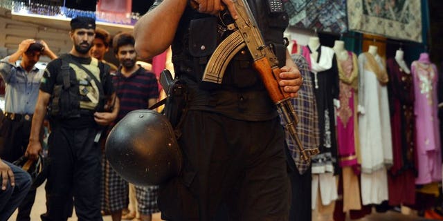 A Pakistani police commando patrols in Islamabad on August 7, 2013. Police in Islamabad are locked in a stand-off with a man armed with two automatic guns who was randomly firing in the air in the Pakistani capital Thursday.