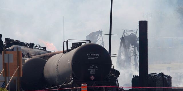 Wreckage burns on July 7, 2013 after a freight train loaded with oil derailed July 6 in Lac-Megantic in Canada's Quebec province. Canadian Pacific Railway will appeal a government order to pay for the clean-up of a deadly train derailment in Canada's Quebec province in July, a spokesman said Thursday.